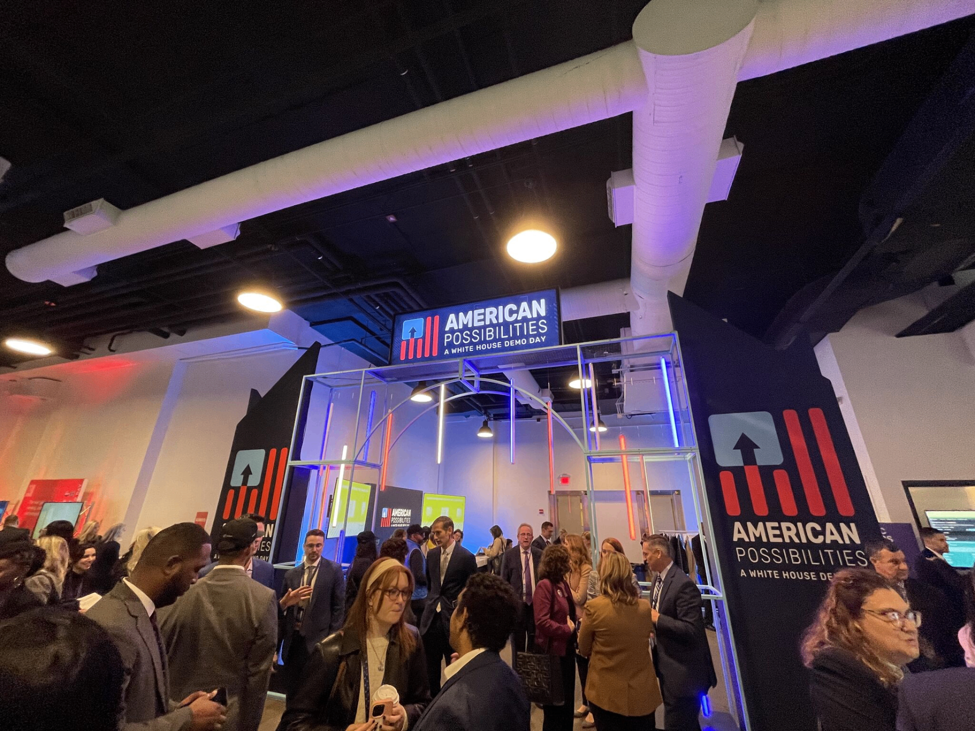 Attendees gathered under the American Possibilities entrance archway at The Showroom